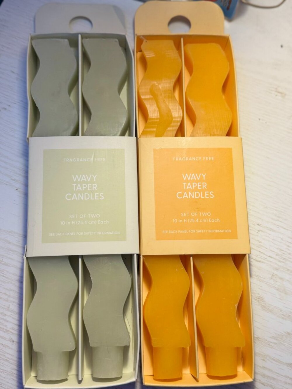 2 wavy taper candles- green and orange